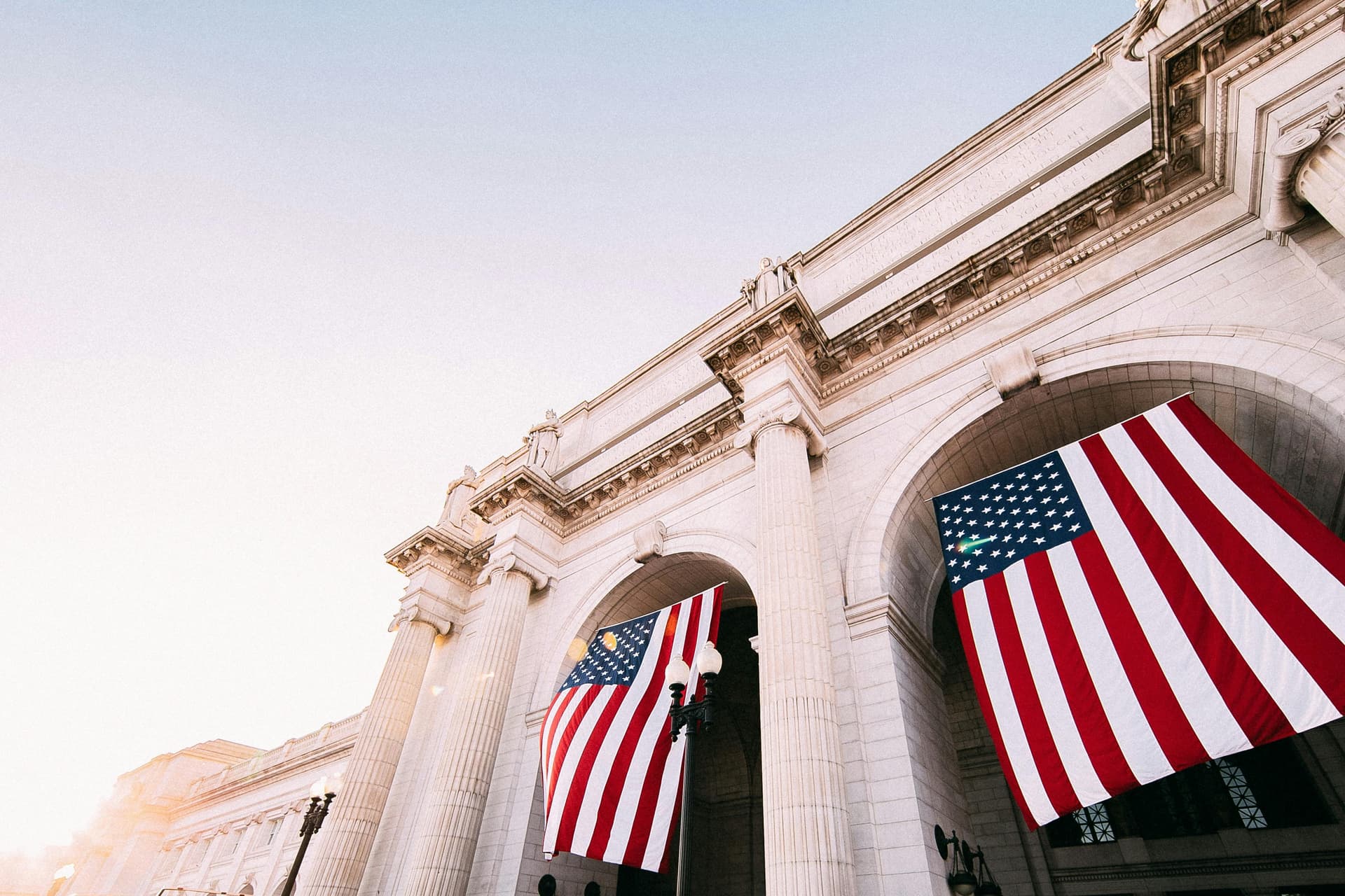 Two American flags hanging outside Union Station in Washington, D.C.